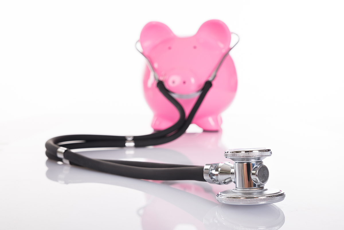 piggy bank wearing stethoscope